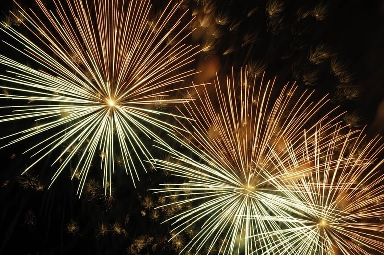 Three bursts of fireworks in proximity.jpeg