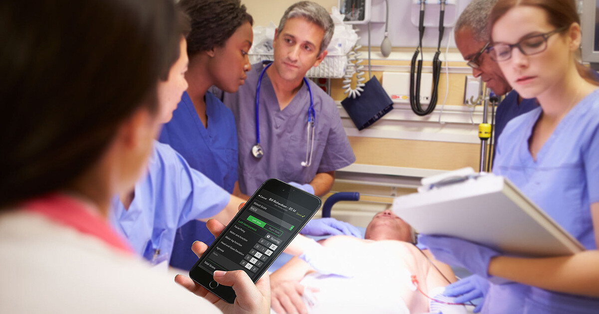 hospital staff gathers around a stroke patient while a nurse inputs the stroke score into pulsara.