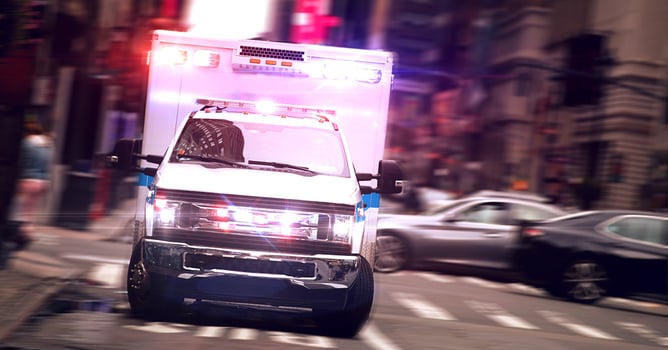 ambulance drives with lights and sirens
