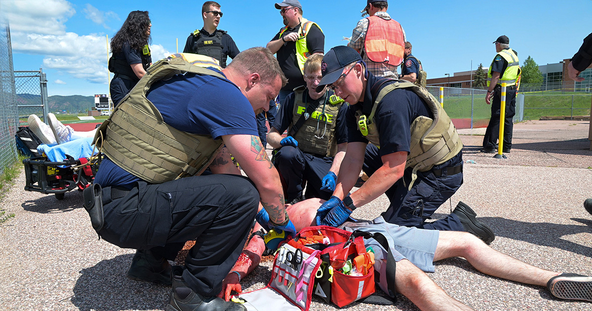 paramedics care for a patient during an MCI