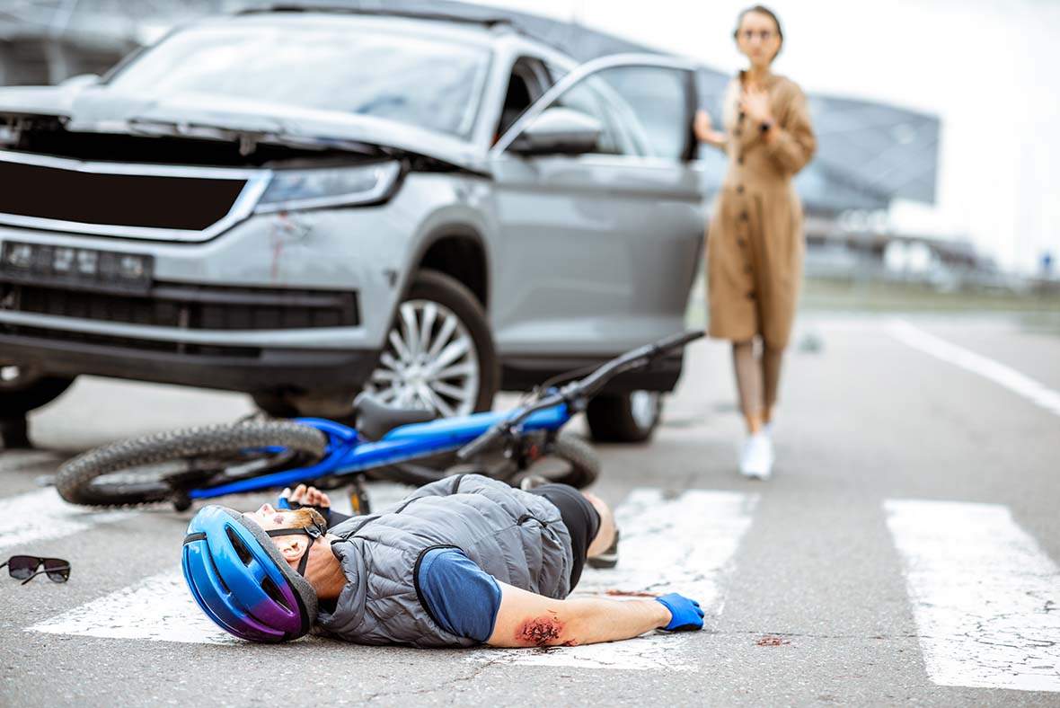 road-accident-injured-cyclist-and-woman-drive-1180x788
