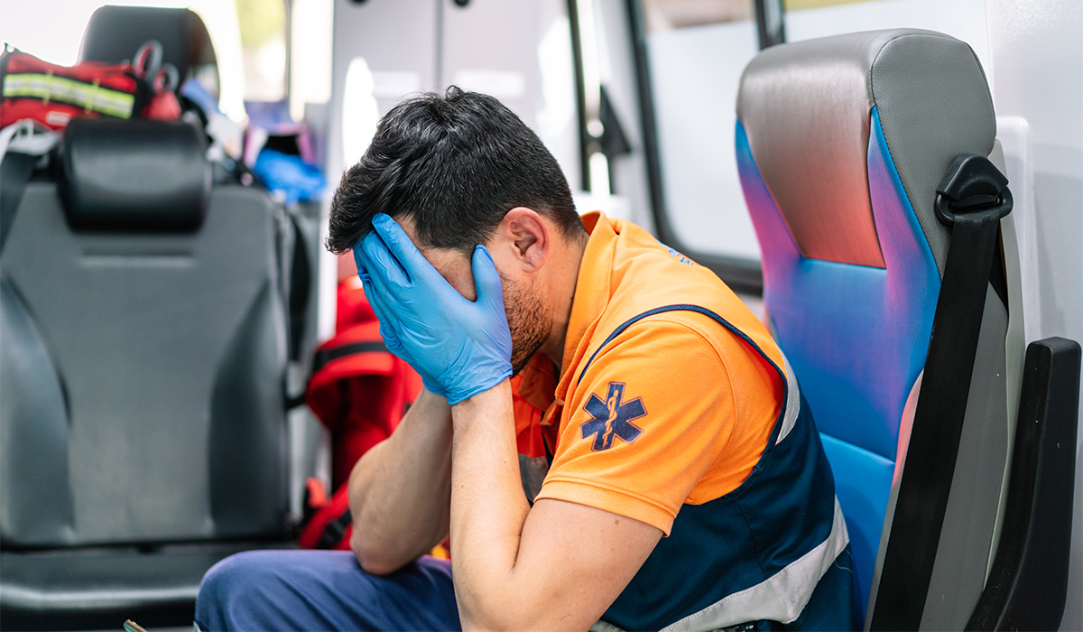 stressed-male-paramedic-in-amb-1200x700