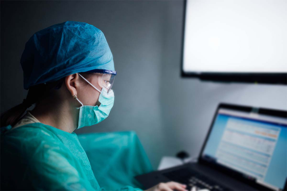 female-surgeon-working-on-computer@1200x800