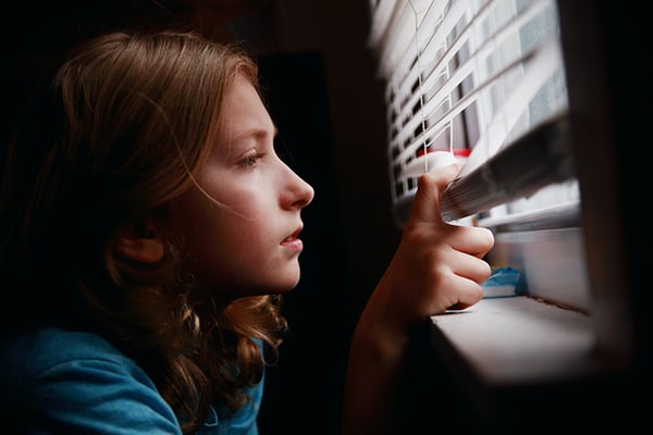 girl-looking-out-window-900x600