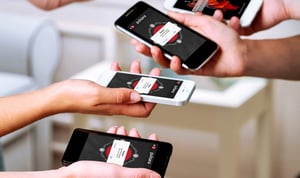 team-group-using-phones