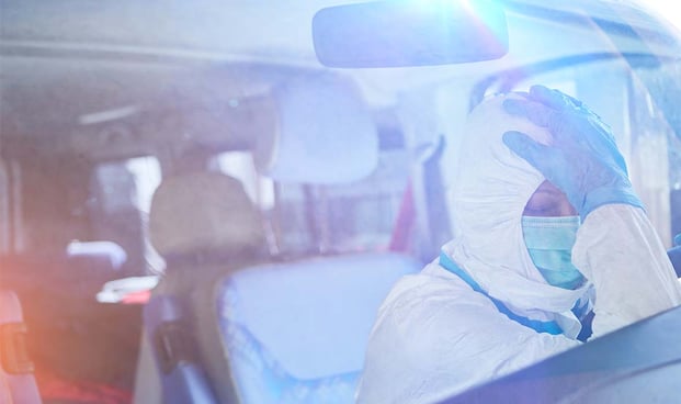 tired-paramedic-ppe-ambulance@1180x700