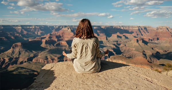 woman-meditating-canyons-1000x525