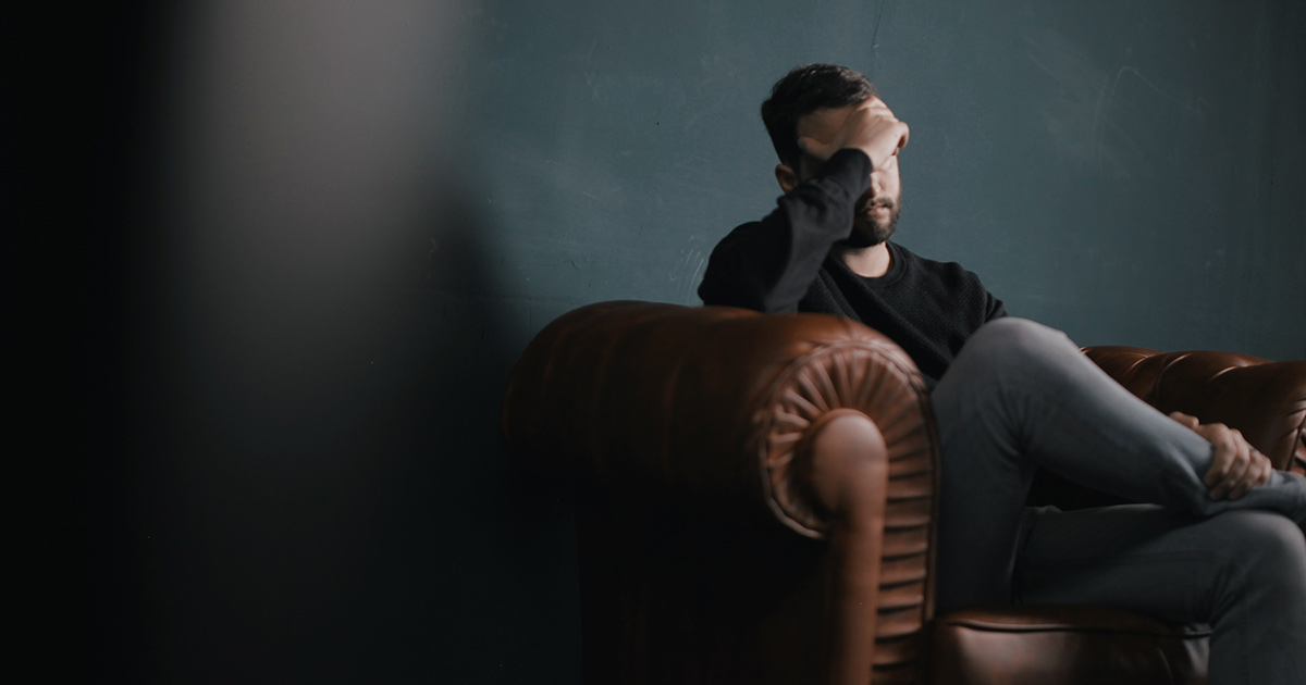 stressed-man-on-couch