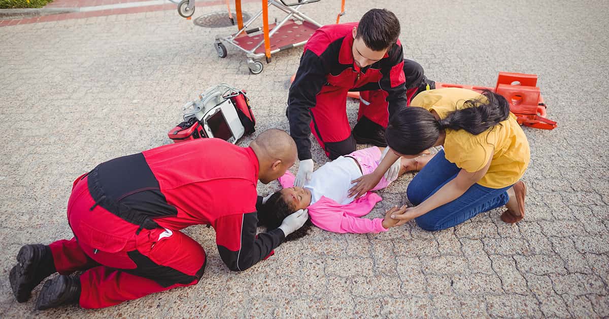 paramedics-examining-injured-girl